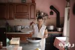 lady in white dress holding a frying pan 3785704 scaled