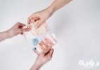 person holding 10 and 10 euro banknotes 3943746 scaled
