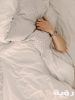 person holding gray and white throw pillow 1029801 scaled