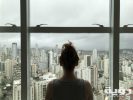 woman standing near glass window 763849 scaled